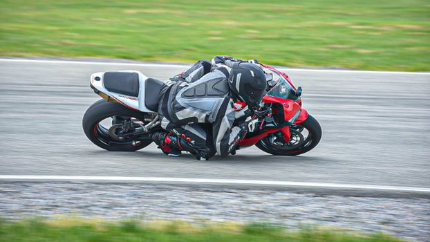 Panning Shot of a Person Riding a Motorbike