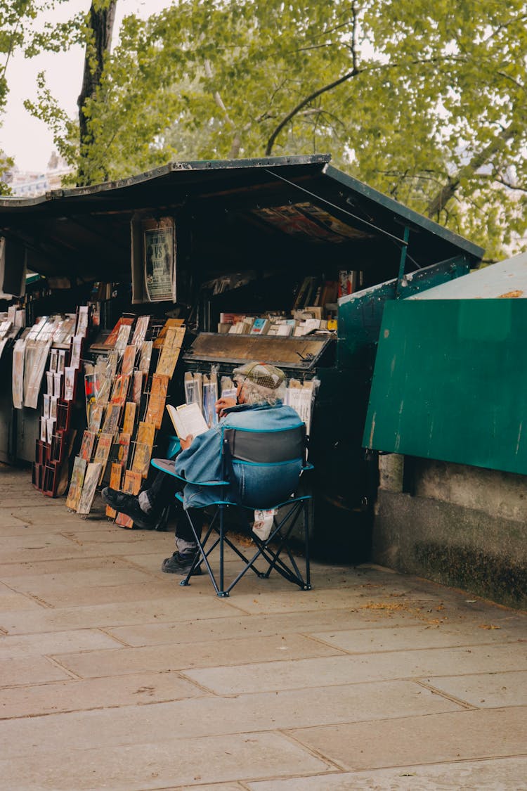 A Stall On The Sidewalk Selling Books