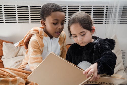 Free Children Reading a Book Stock Photo