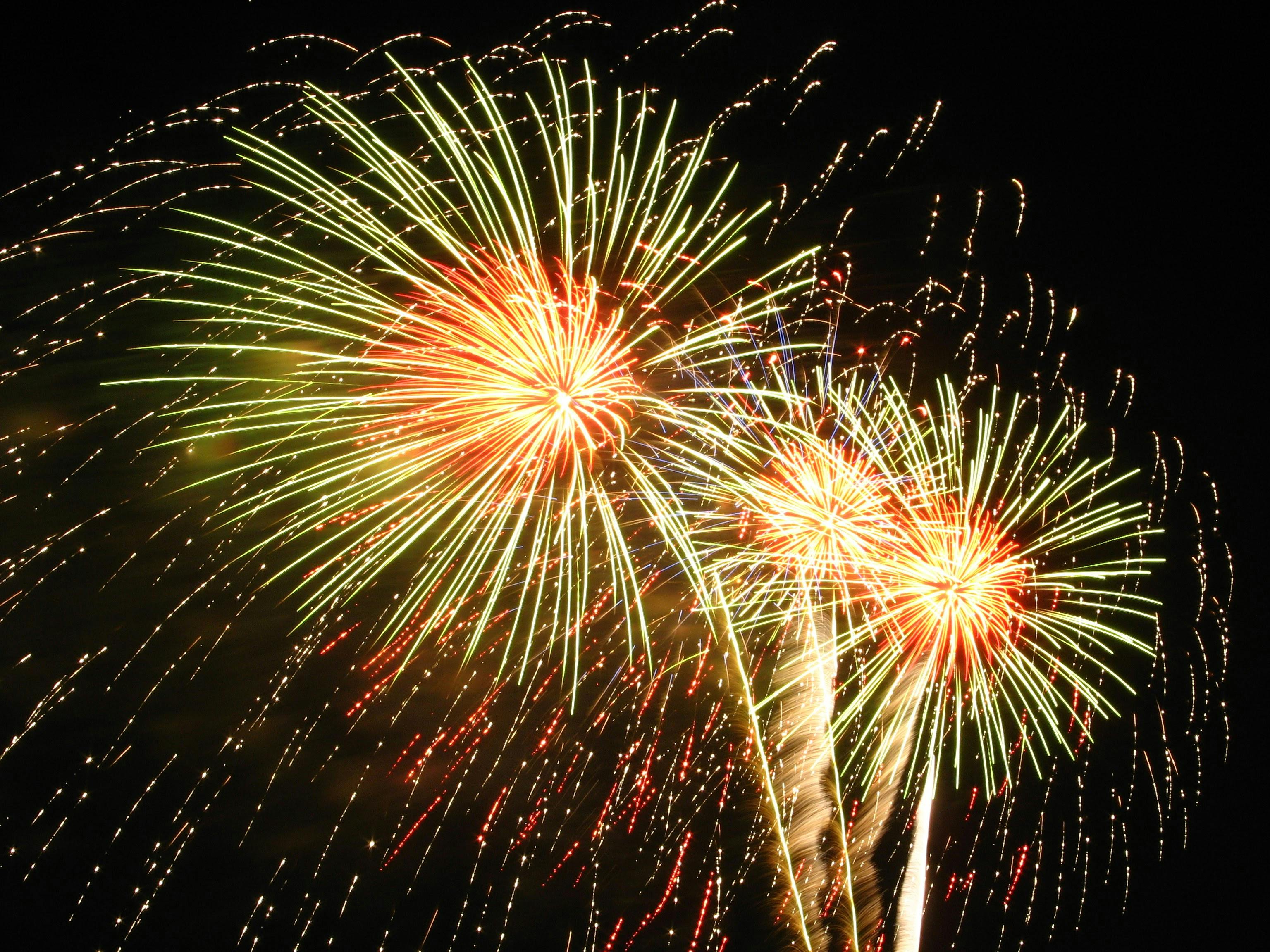 Silhouette Photo of Standing Man Holding Camera Looking at Fireworks ...