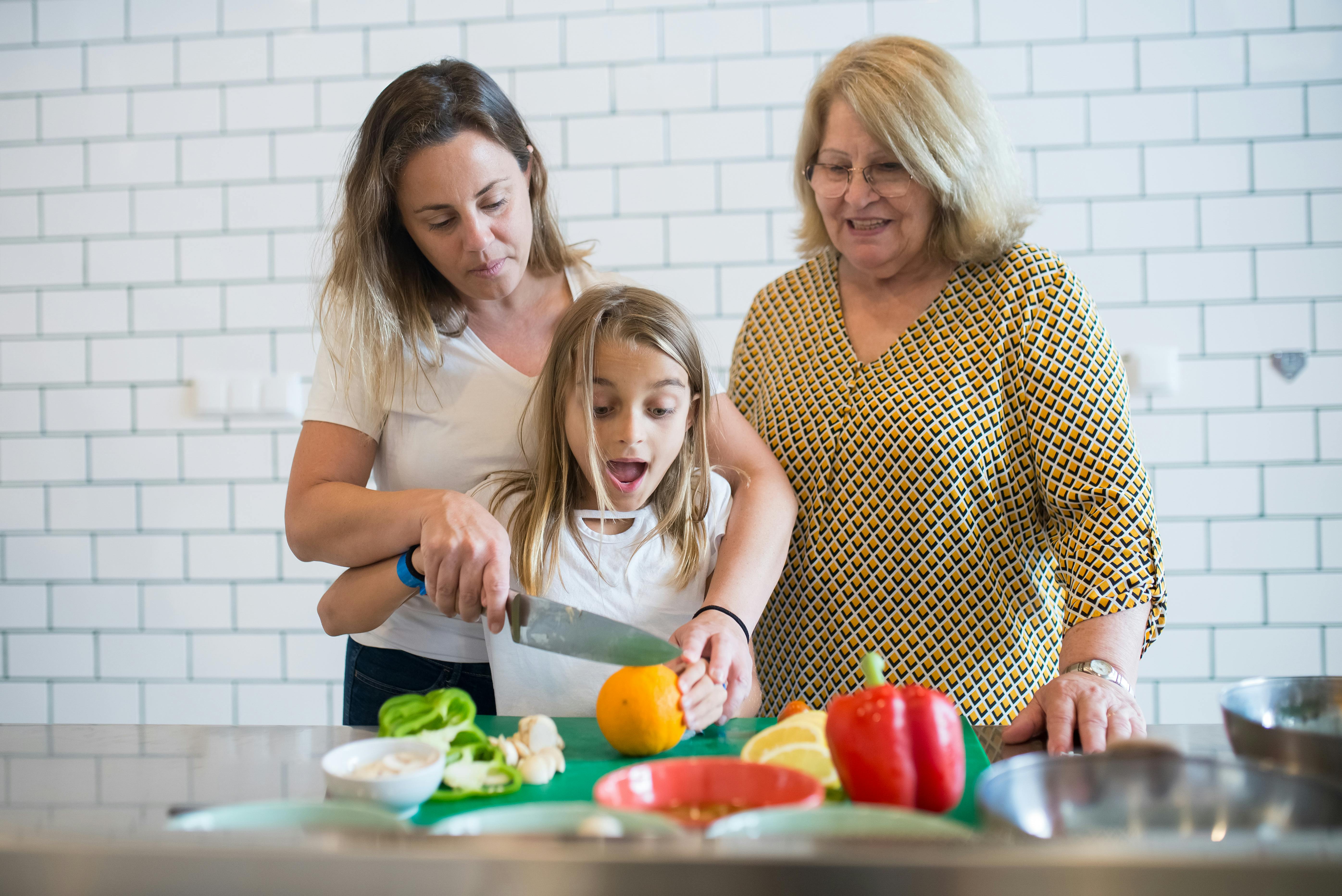 women preparing food in the kitchen