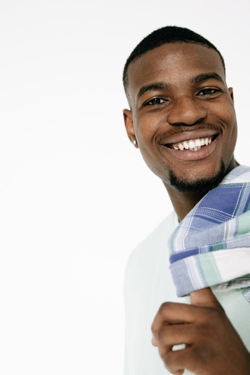 Smiling Man in White T-Shirt