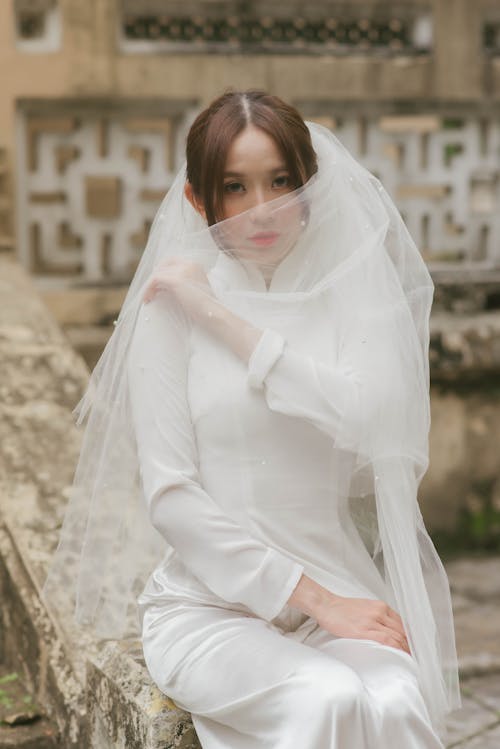 A Bride Covering Face with Her Veil