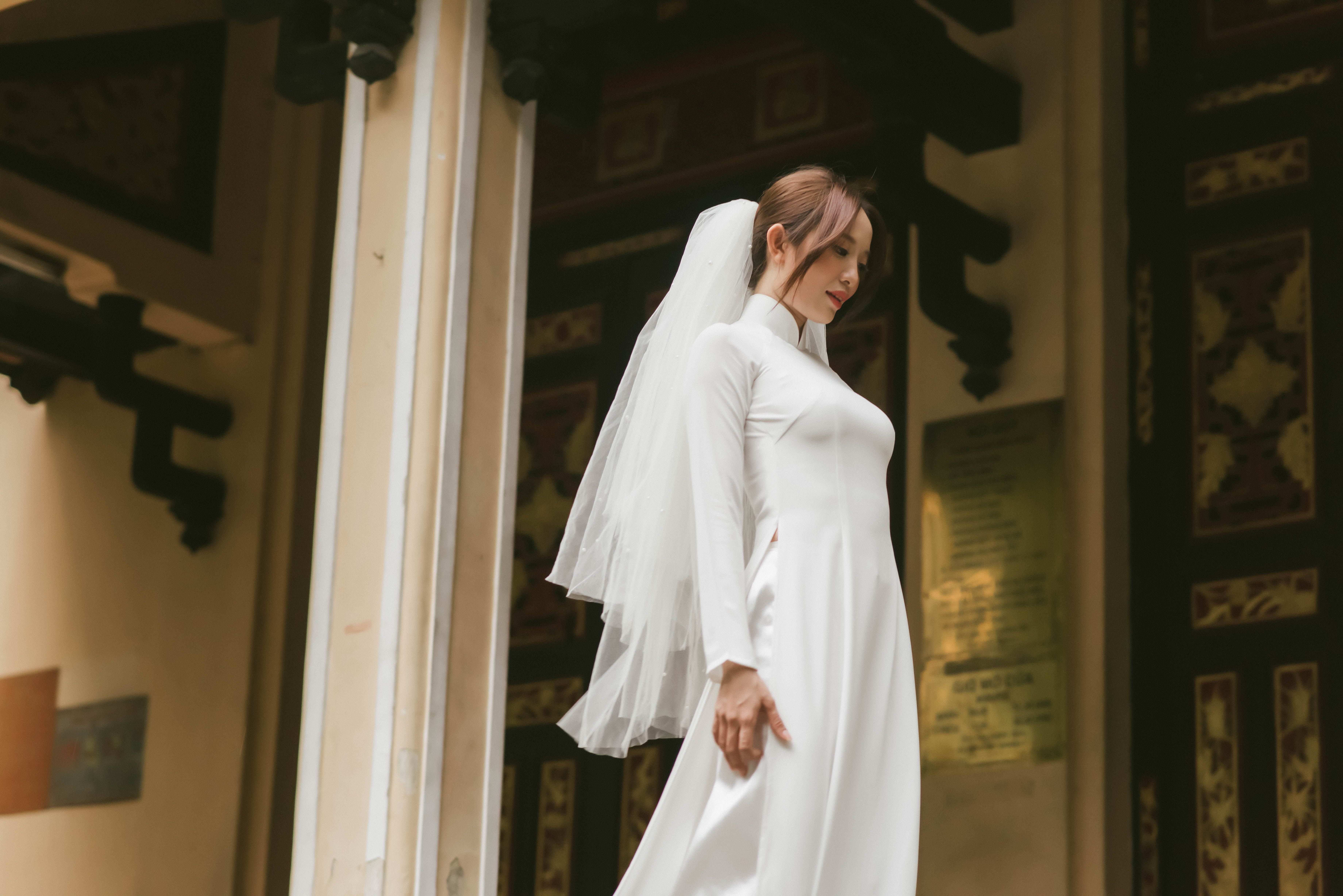 Beautiful Bride Wearing a White Wedding Dress Looking Back · Free Stock ...