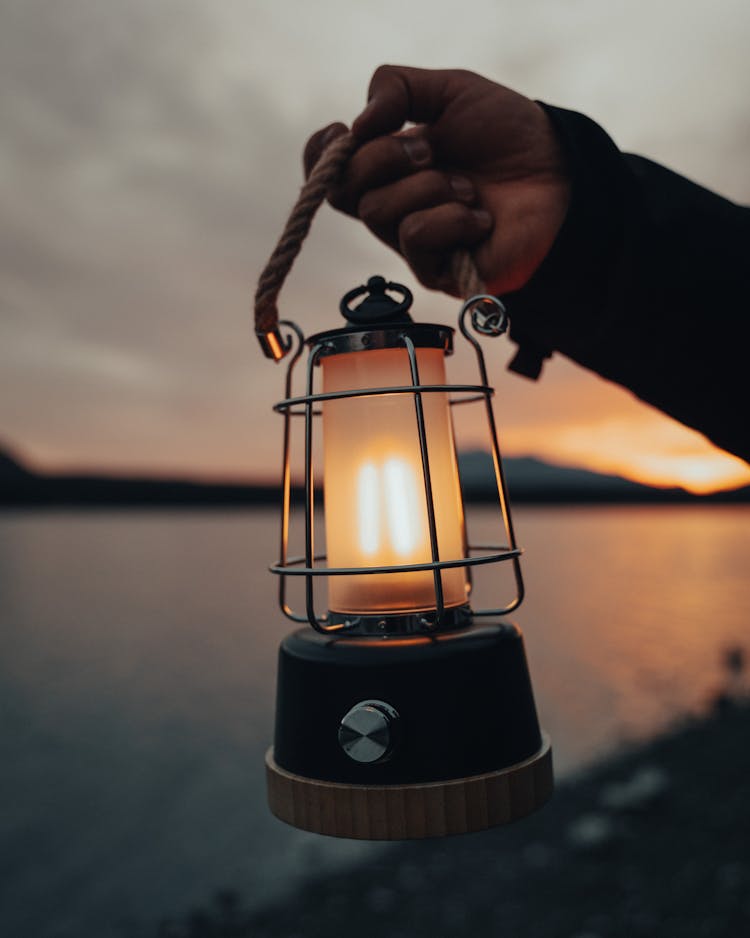 Hand Holding Lantern