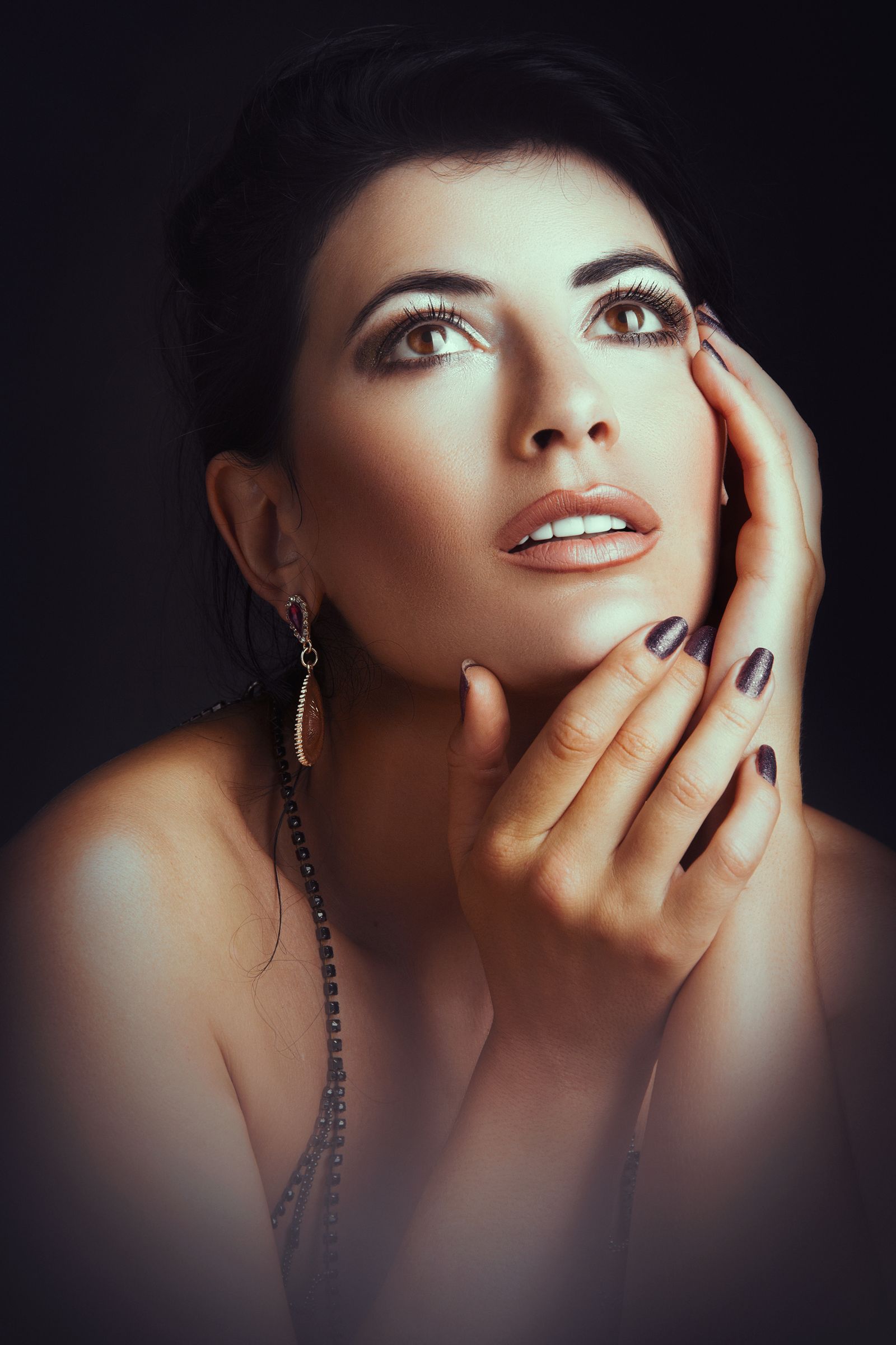Editorial portrait of a woman with fine jewelry