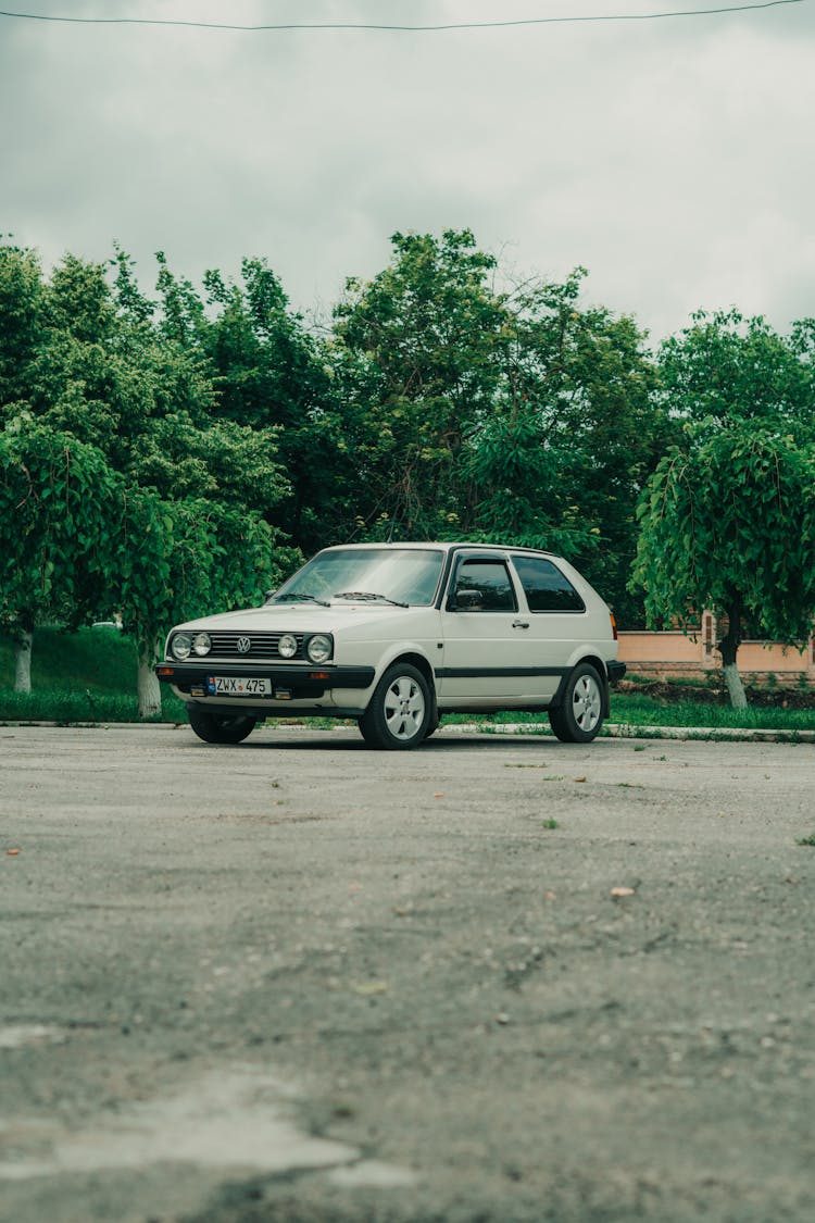 White Car Parked Near The Park