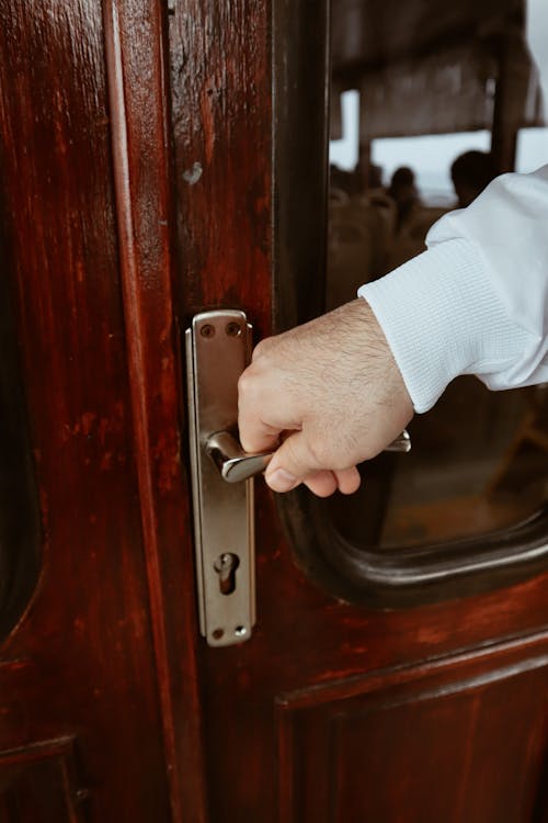 Close-Up Shot of a Person Opening a Door