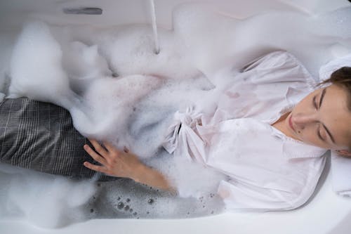 Free A Woman Soaking on a Bubble Bathtub Stock Photo