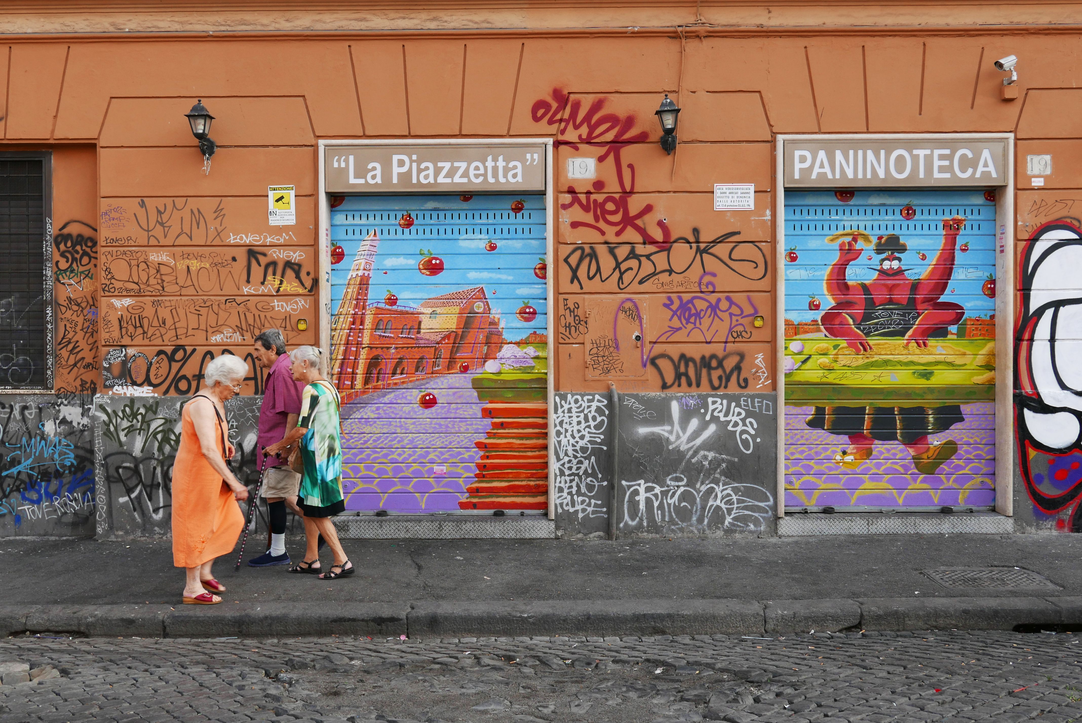 A charming cobblestone street in Rome's Trastevere neighborhood, perfect for walking exploration.