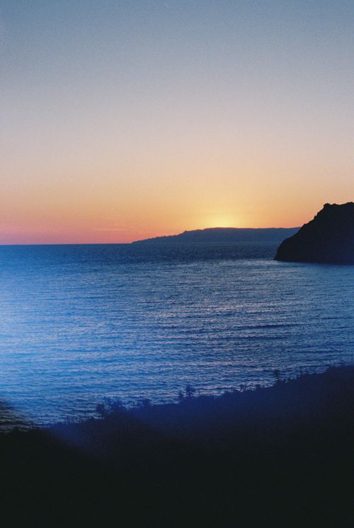 Free Stunning sunrise view over the sea in Patmos, Greece, capturing the serene beauty of the landscape. Stock Photo