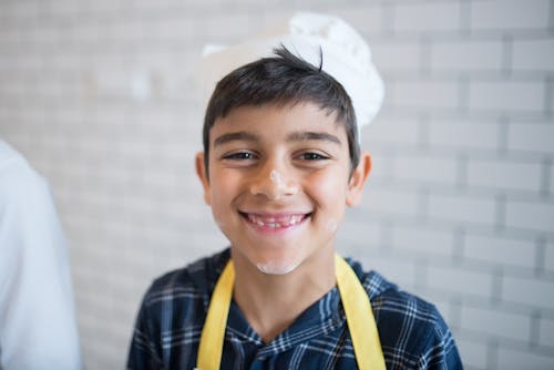 Close-Up Shot of a Boy in the Kitchen