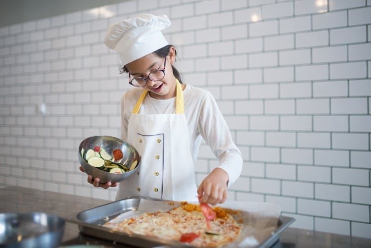 A Young Chef Making Pizza