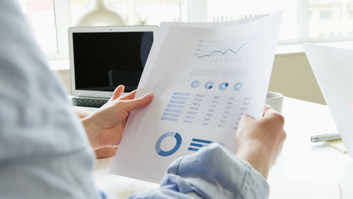 Person reviewing financial report and credit details calmly at a desk