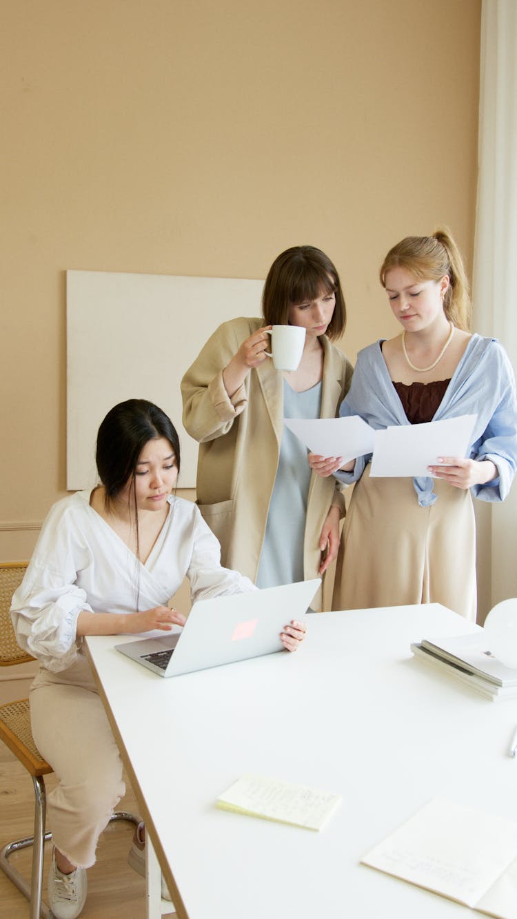 Three Women Working In The Office