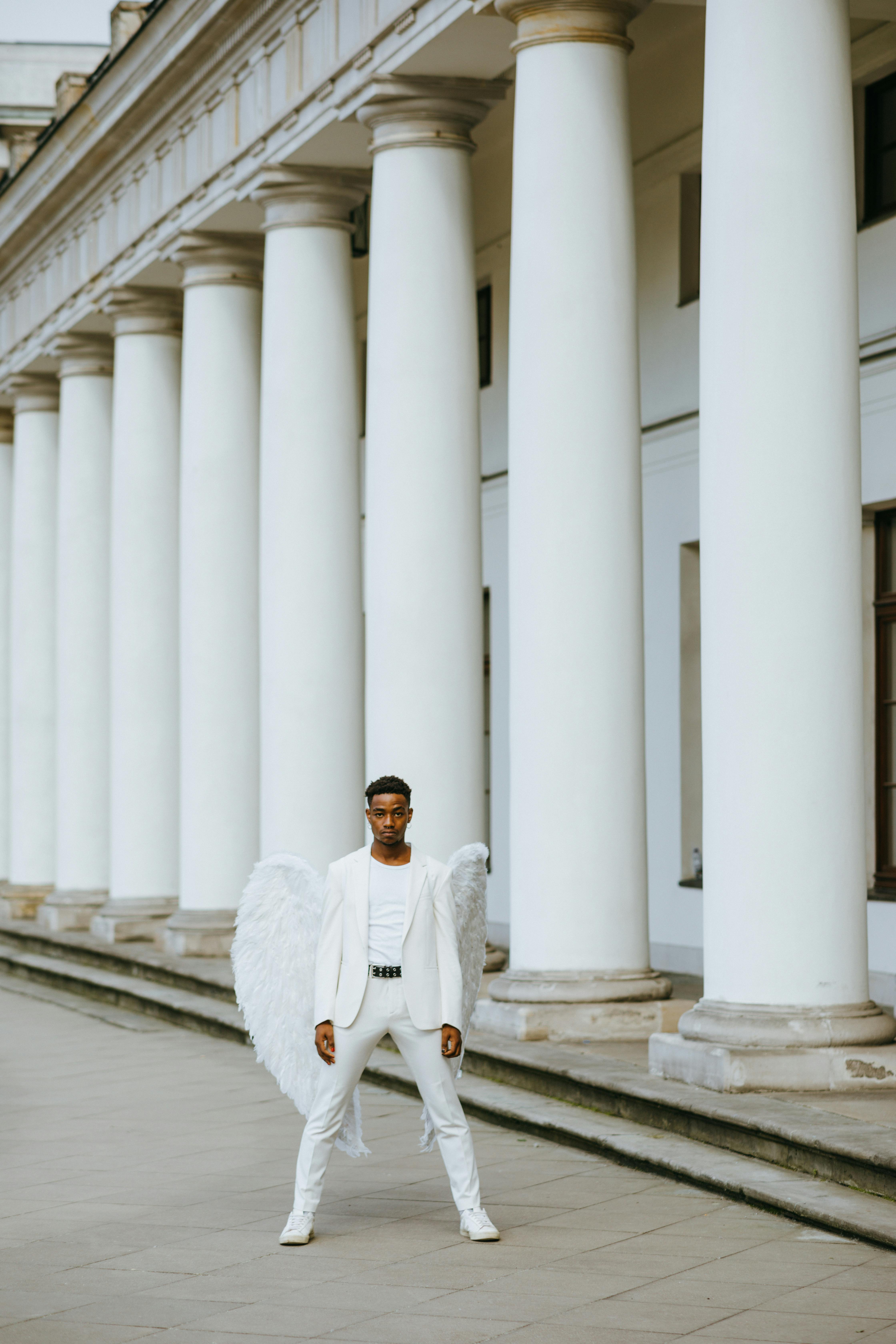 an angel standing near the columns