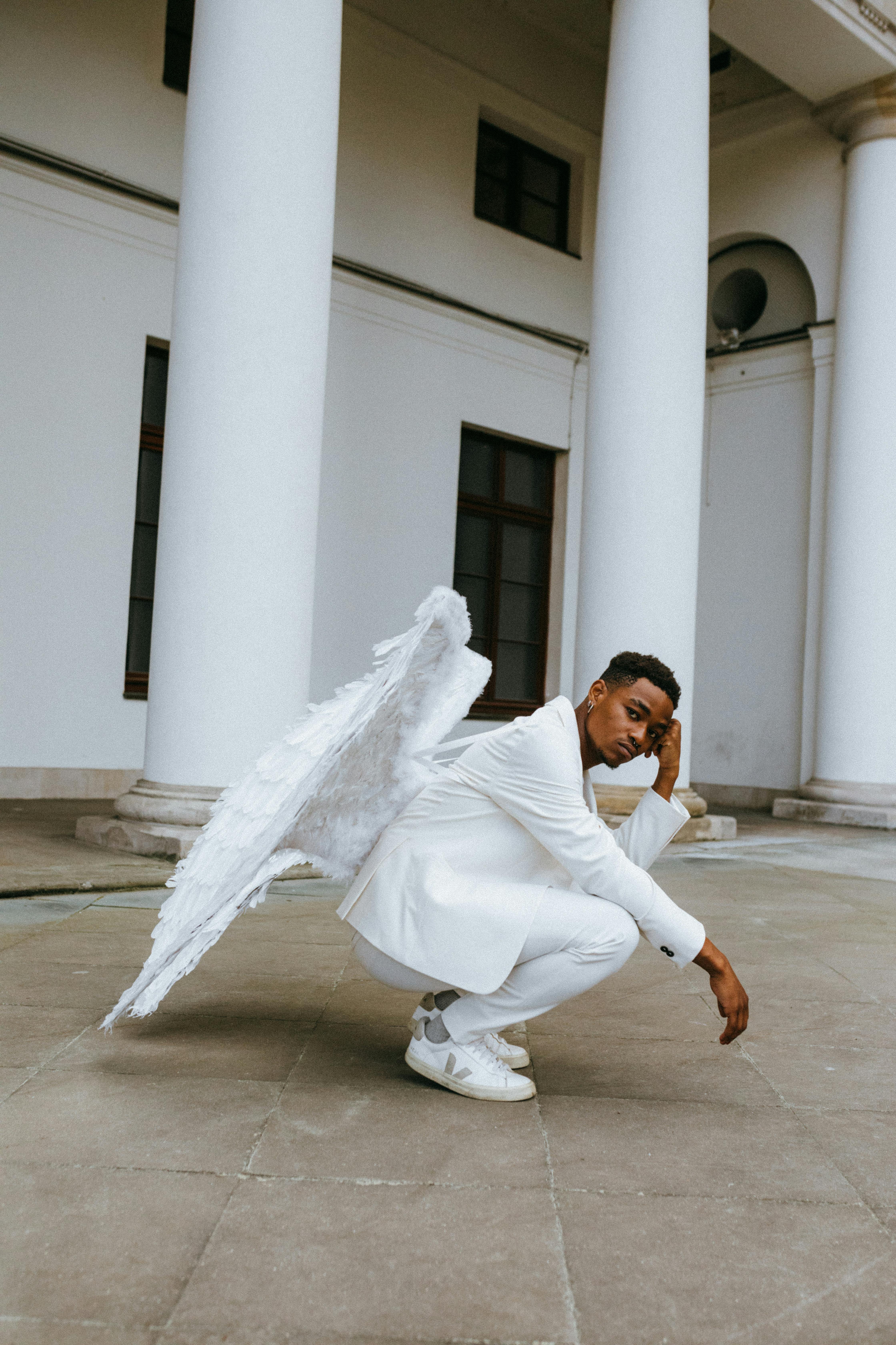 A Man Wearing an Angel Costume · Free Stock Photo