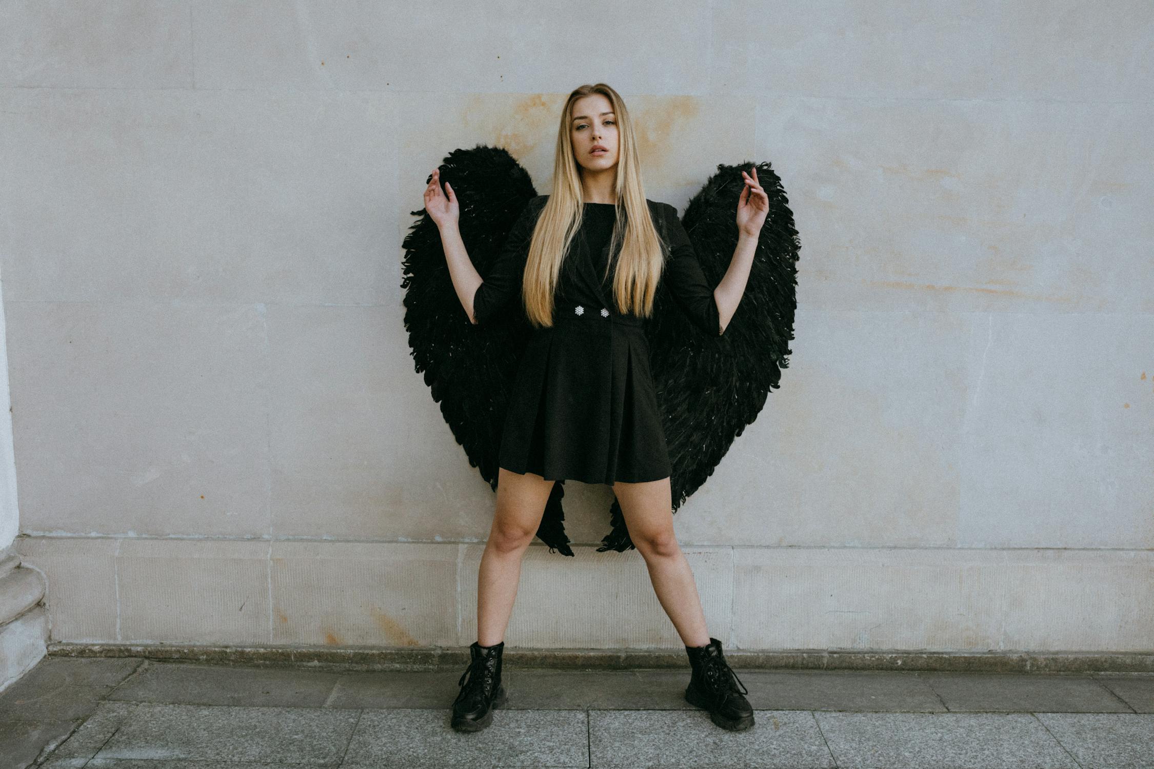 Divine Photo by KoolShooters from Pexels: https://www.pexels.com/photo/a-woman-wearing-an-angel-costume-8512267/