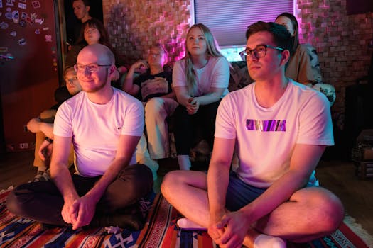 A group enjoys live music in a cozy indoor setting with vibrant lighting.