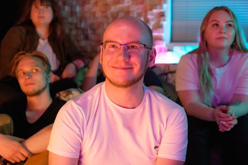 A Man Smiling Wearing Eyeglasses