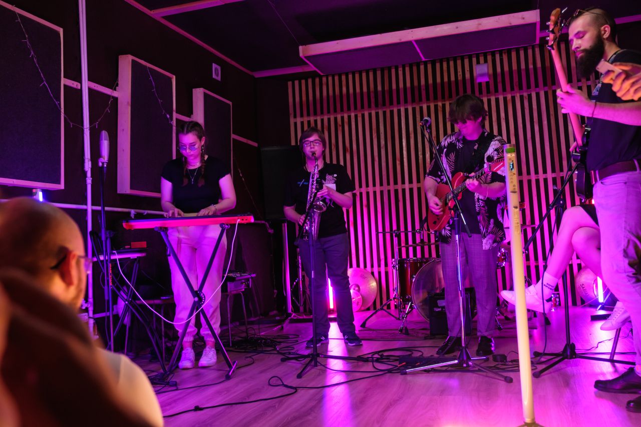 Band performing on a small live music stage