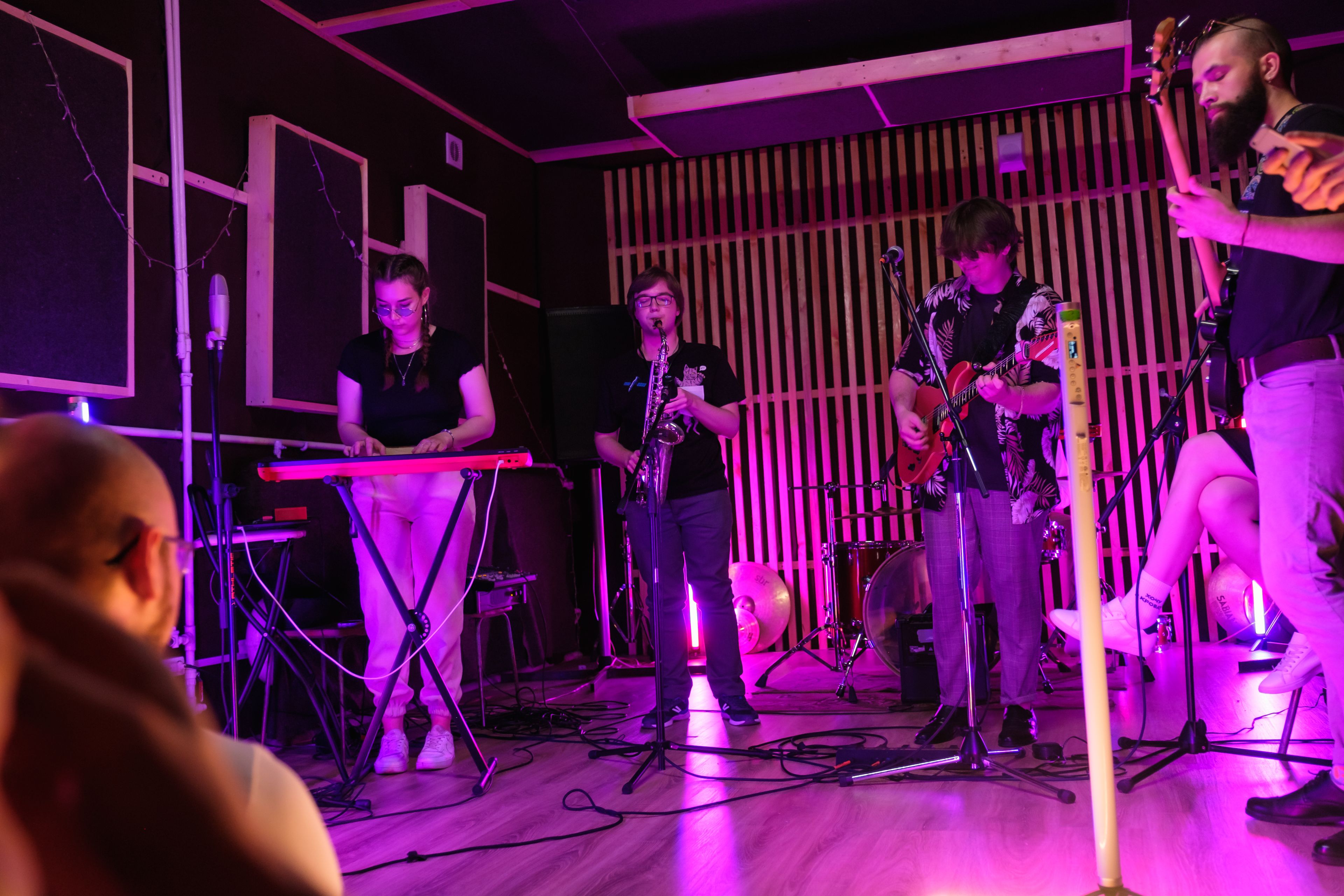 A band playing a small stage