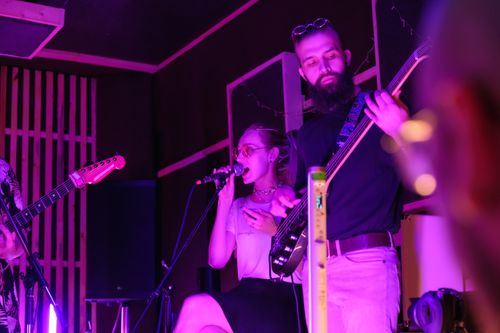 Free Engaging live band performance featuring musicians with vibrant lighting. Stock Photo
