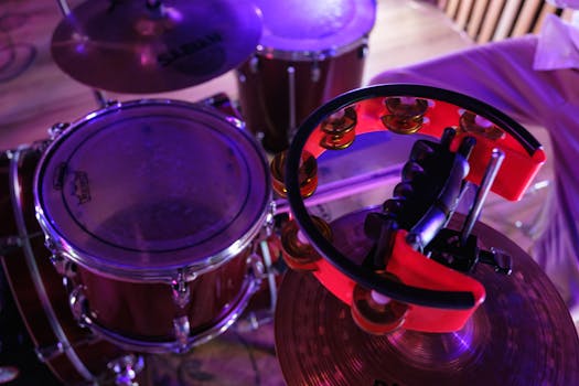 Close-up view of a drum set with a colorful tambourine, highlighting musical essence.