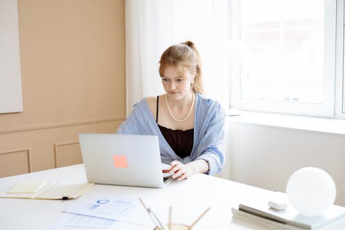 Woman Using a Laptop at the Office