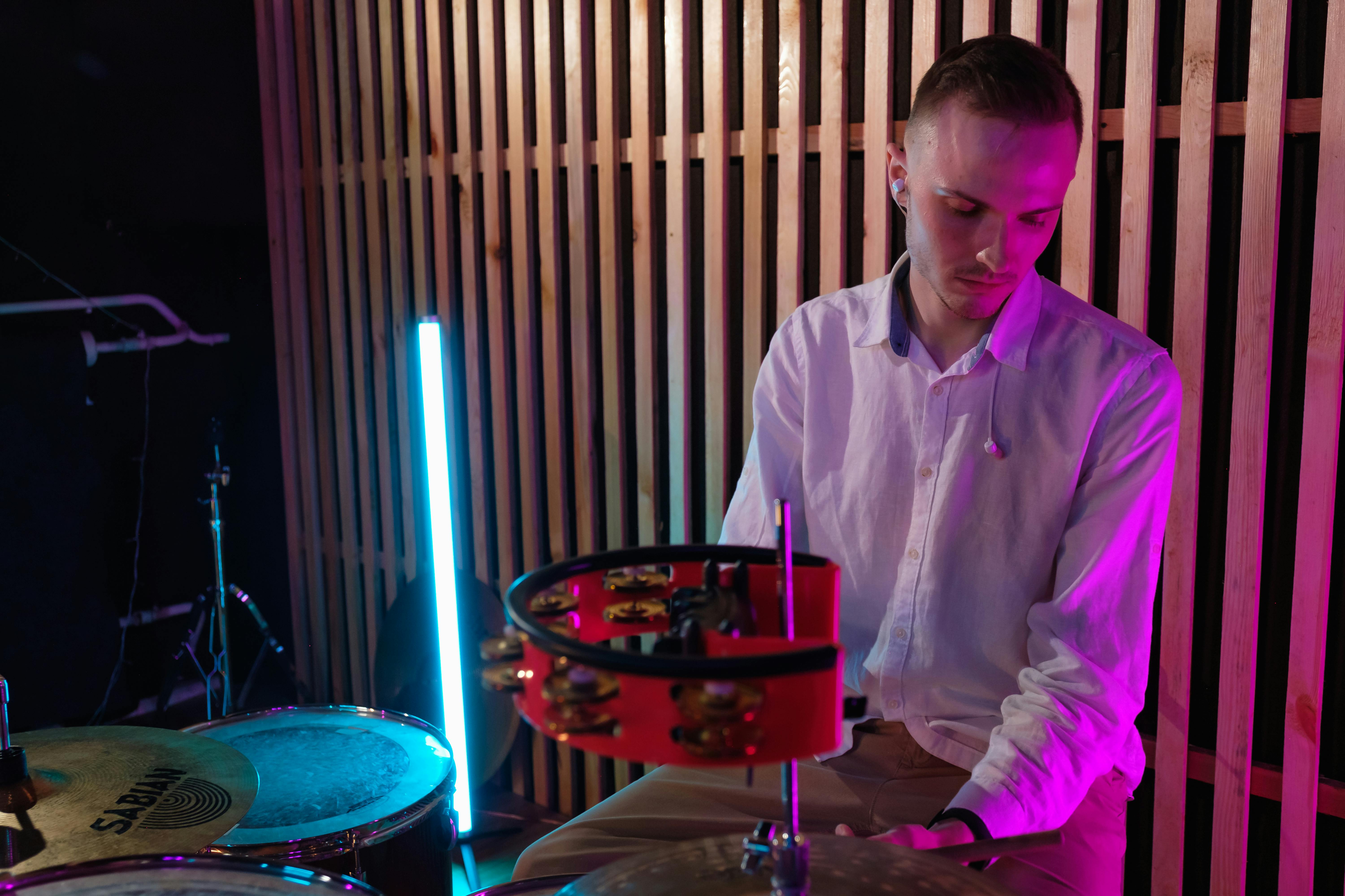 male drummer playing drums