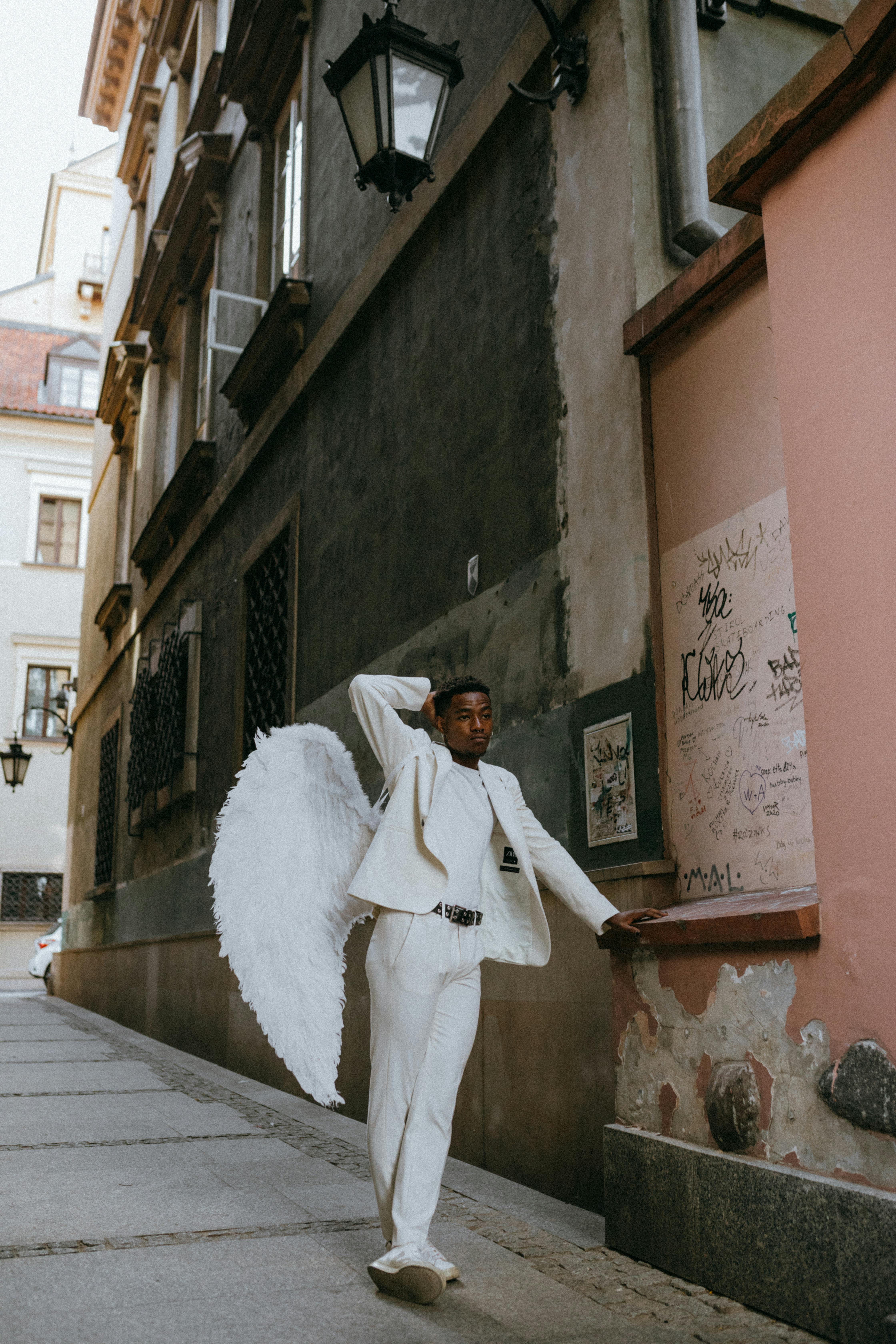 an angel leaning on a wall