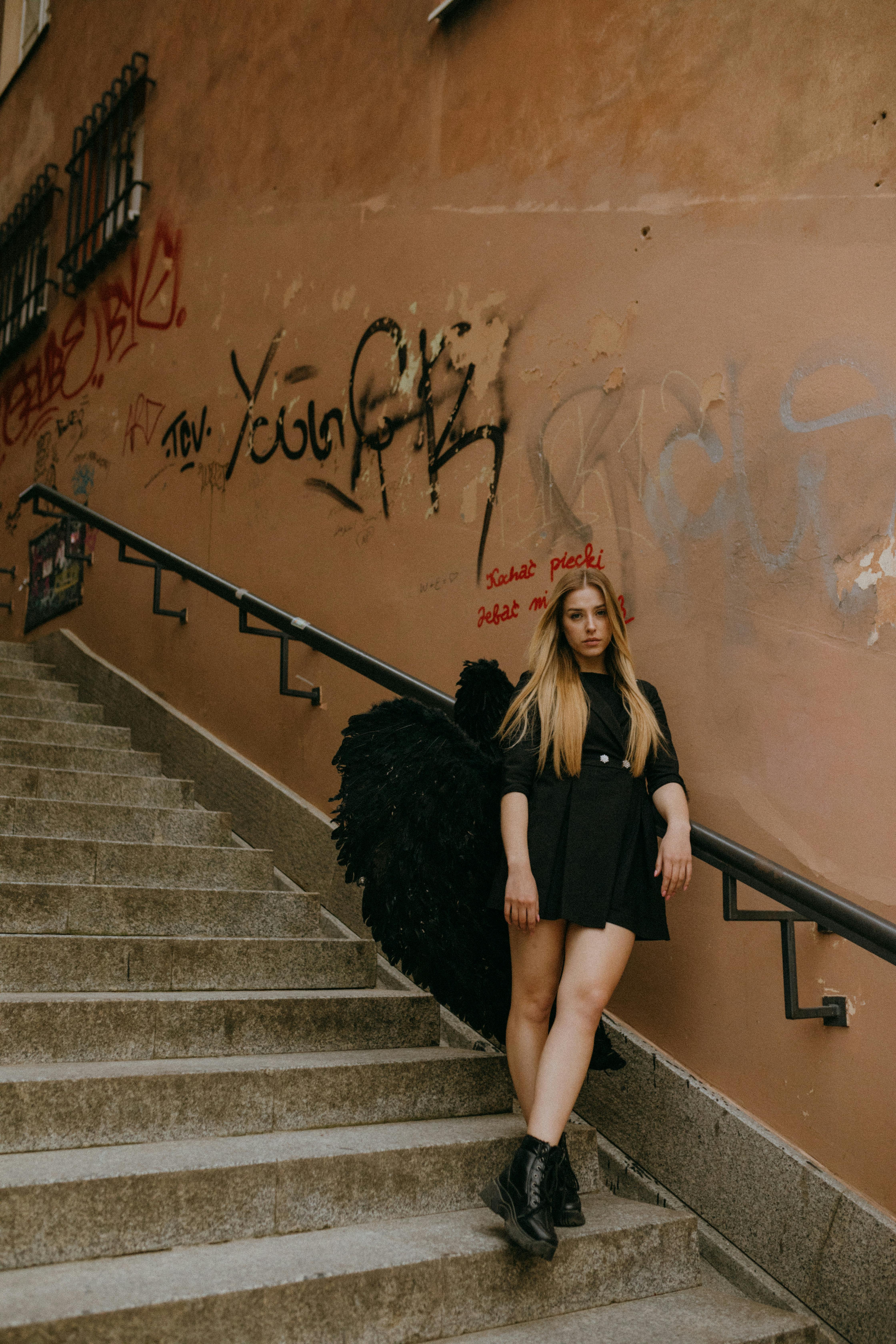 an angel standing on a staircase