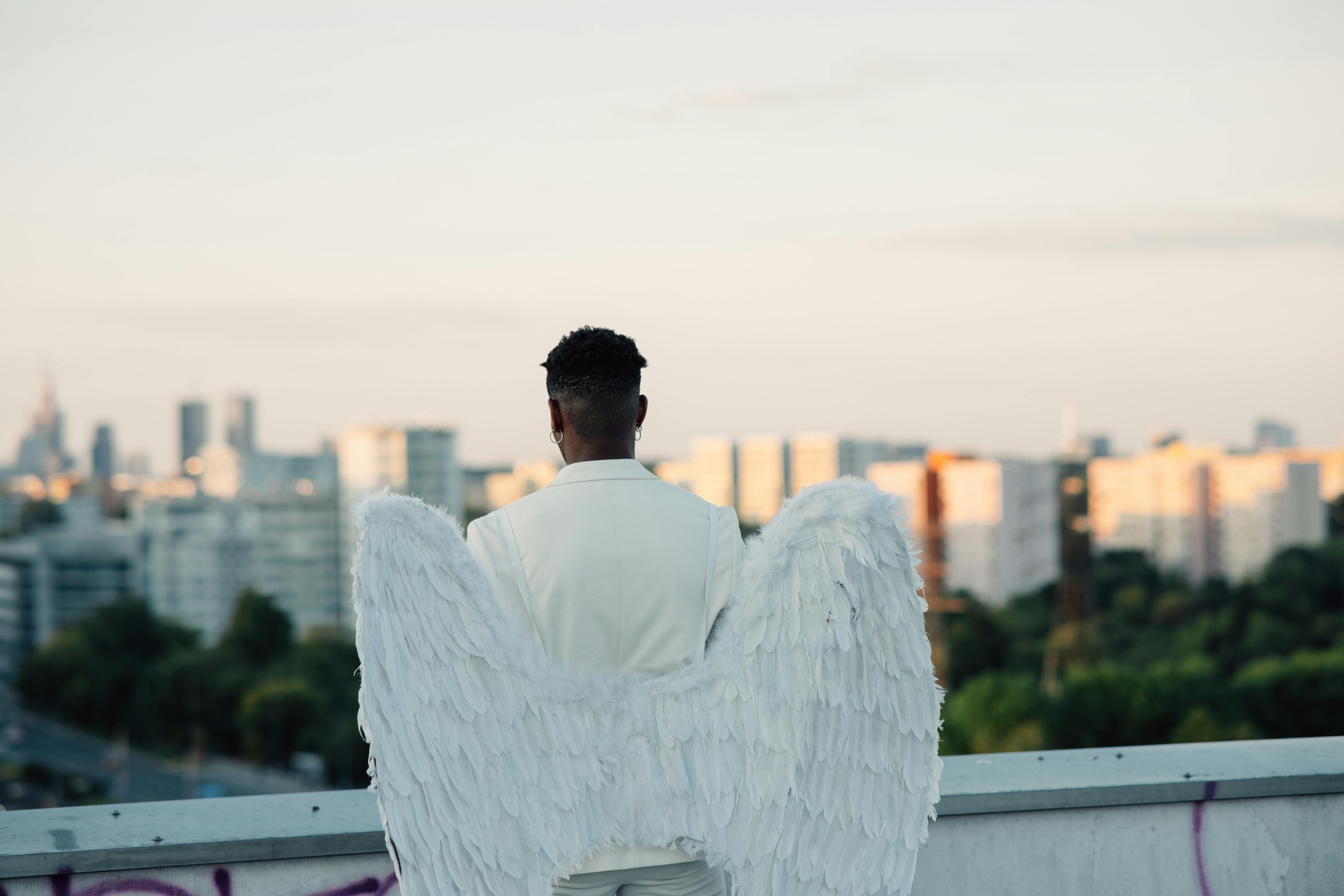 back view of a man wearing an angel costume