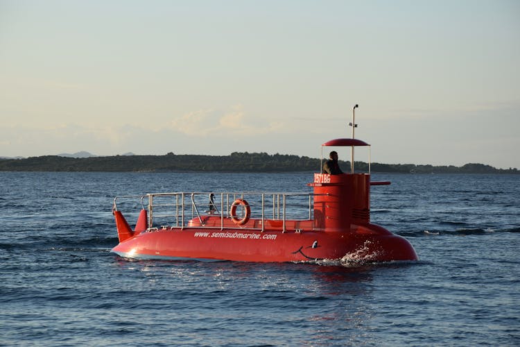 Red Submarine In Body Of Water