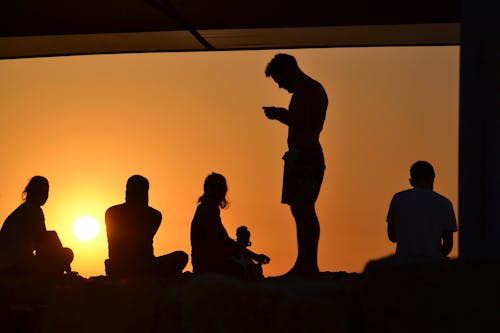 Silhouette of People During the Golden Hour 