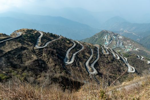 Breathtaking view of the serpentine roads and mountains of Zuluk in Sikkim, India.