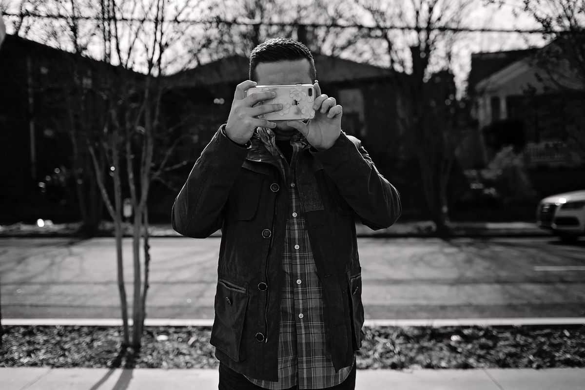 Person documenting outdoor property condition