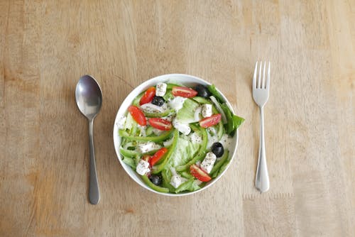 Free Vegetable Salad on a Bowl With Spoon and Fork  Stock Photo