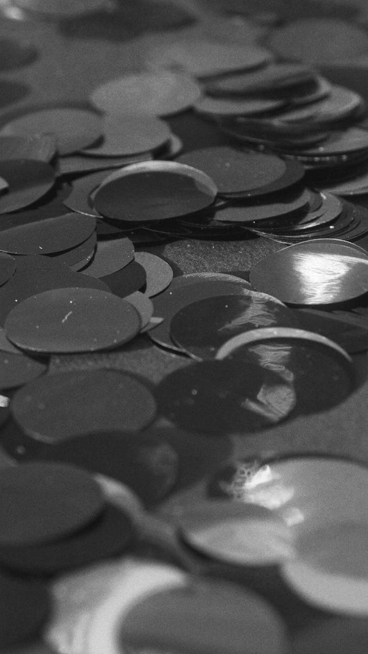 Grayscale Photo Of Round Confetti