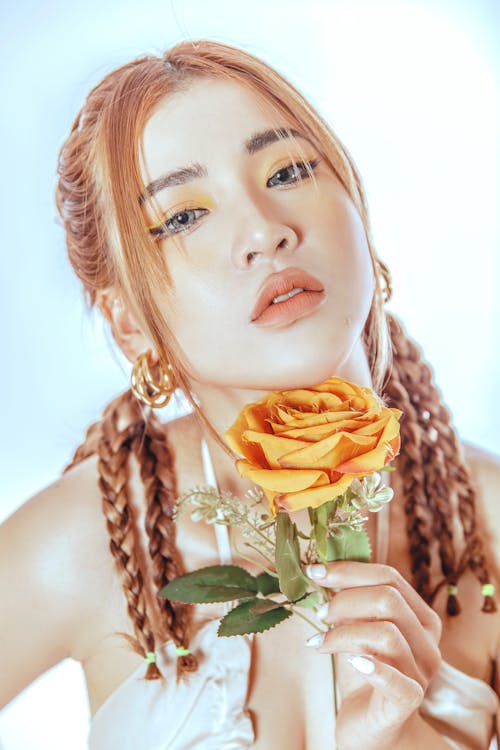 Beautiful Woman Holding Yellow Rose