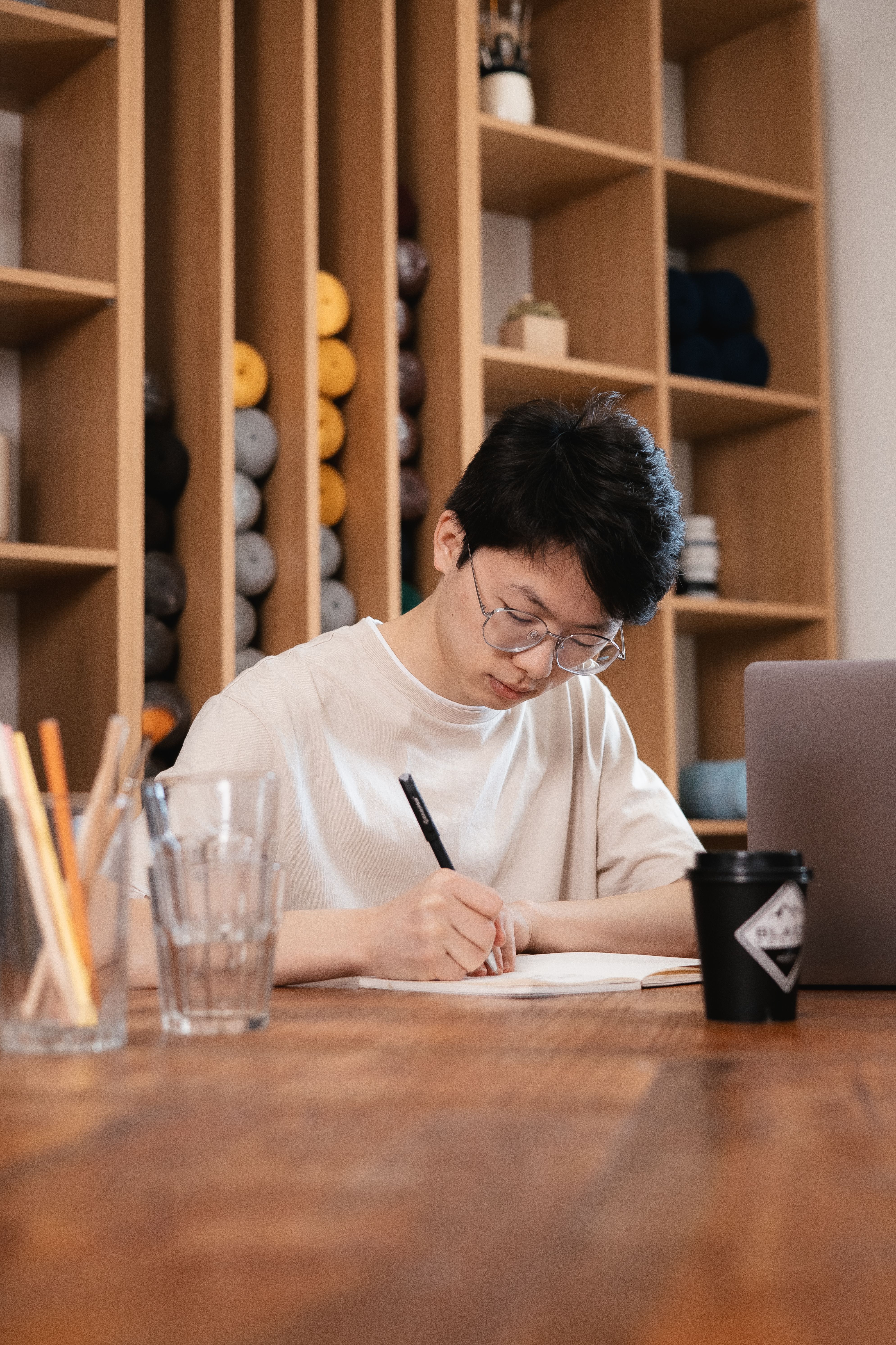A Man Writing while Sitting · Free Stock Photo