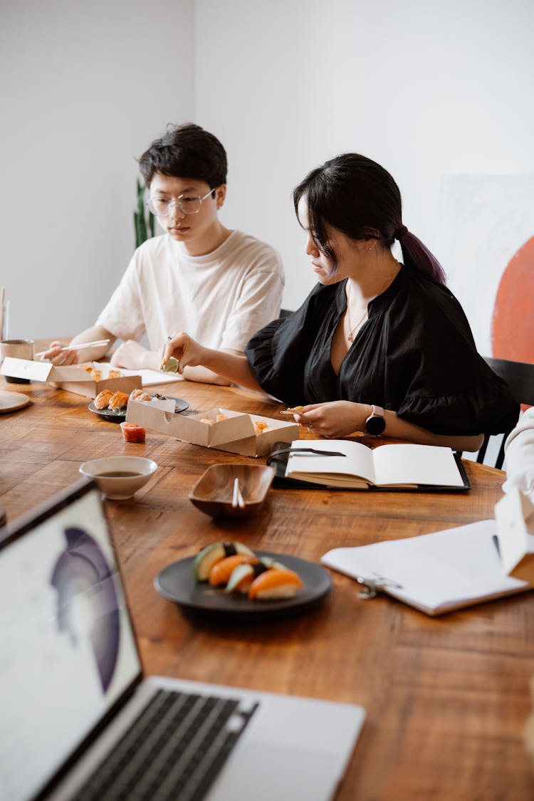 Colleagues Eating In A Conference Room