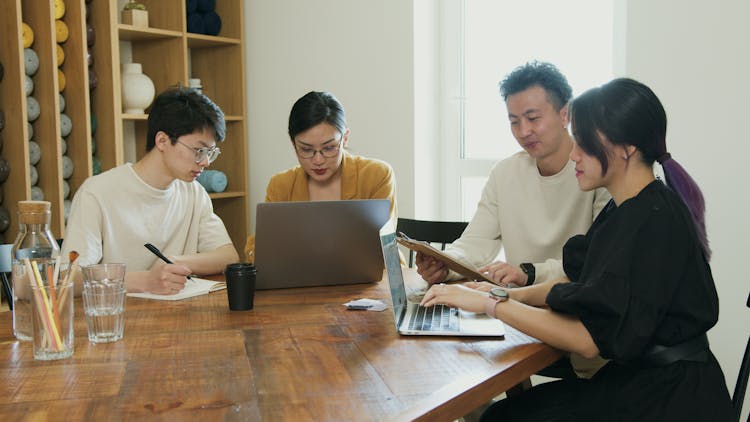 A Group Of People Working Together