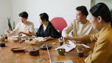 Woman in Black Shirt Sitting beside Man in White Shirt