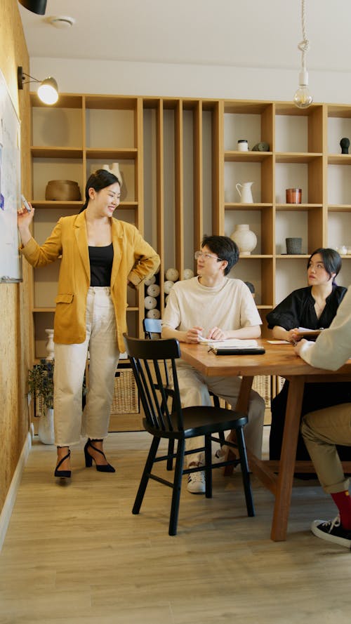 Woman Presenting at the Meeting