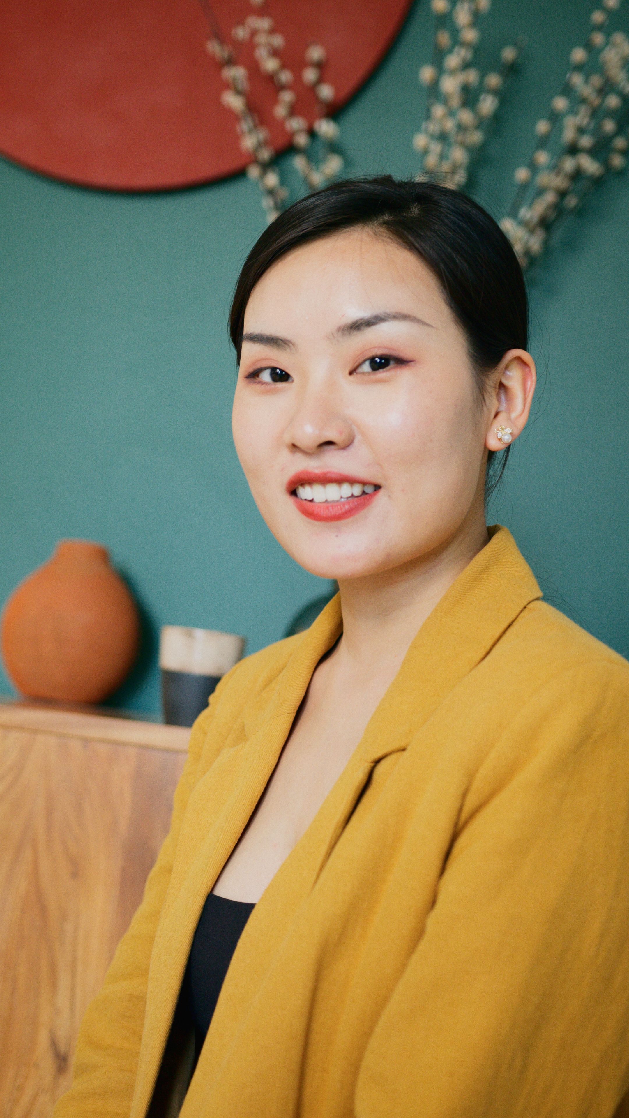 Woman in Yellow Blazer Smiling · Free Stock Photo