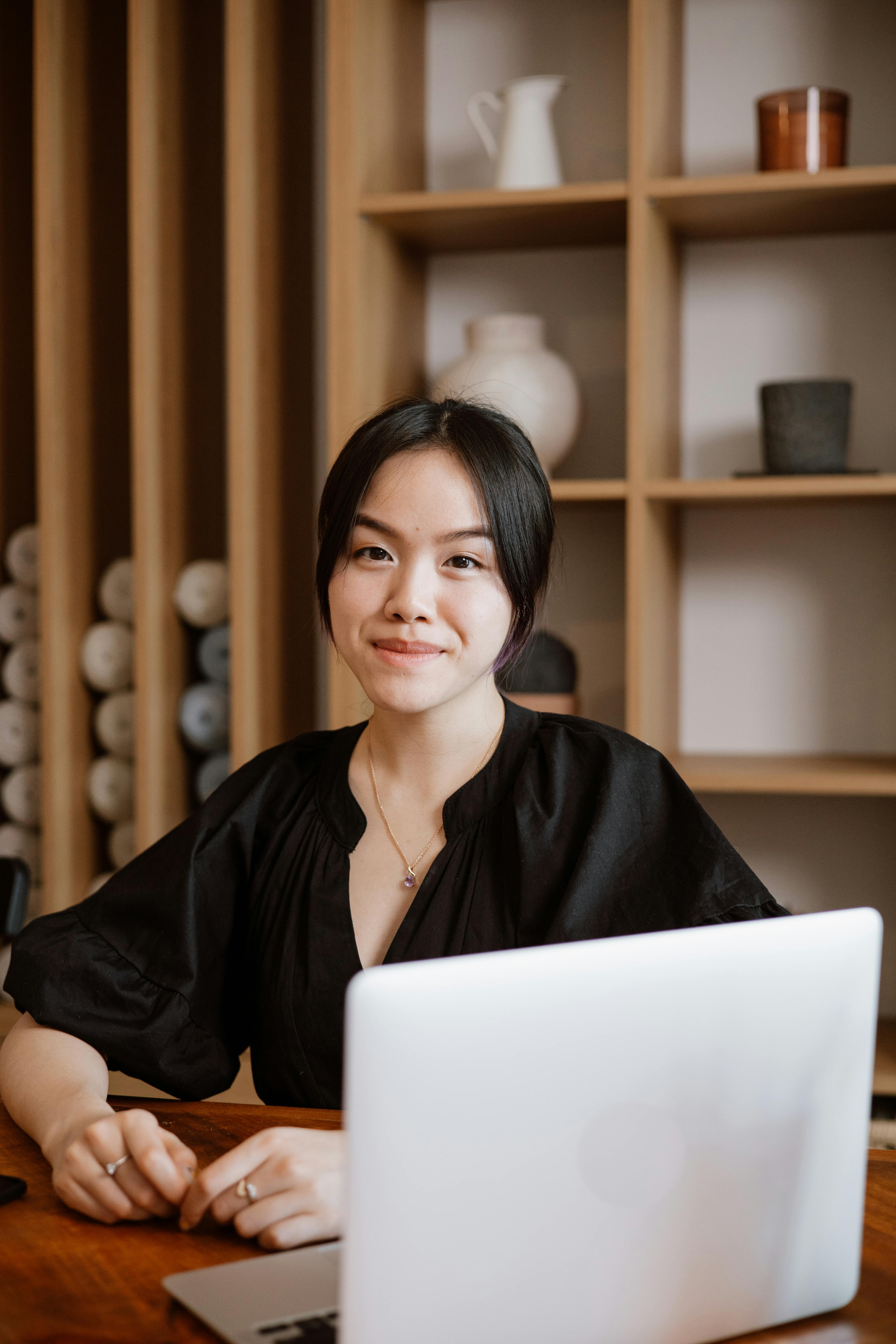 woman in black shirt smiling