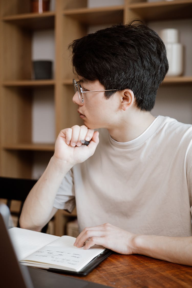 A Man In A White Shirt Thinking