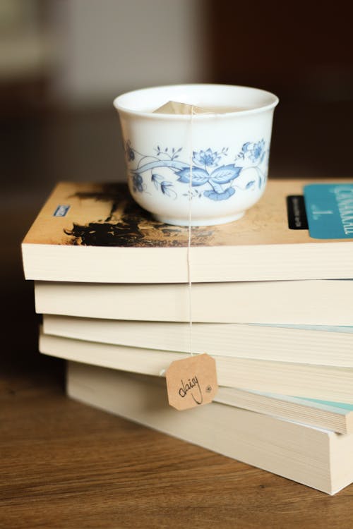 Cup of Tea on Top of a Stack of Books