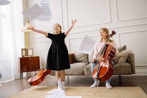 A Woman and a Girl Playing Cello